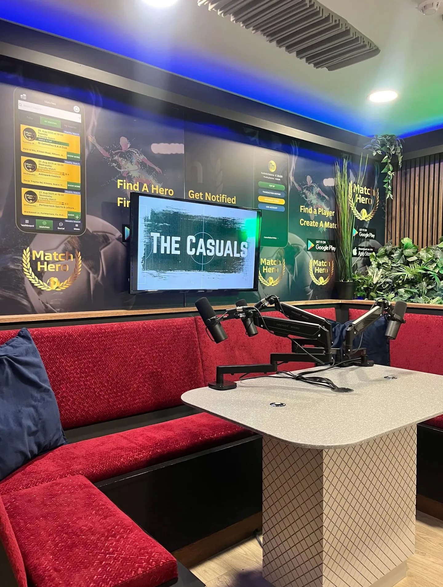 The booth as the Match Hero set, app screens covering the walls